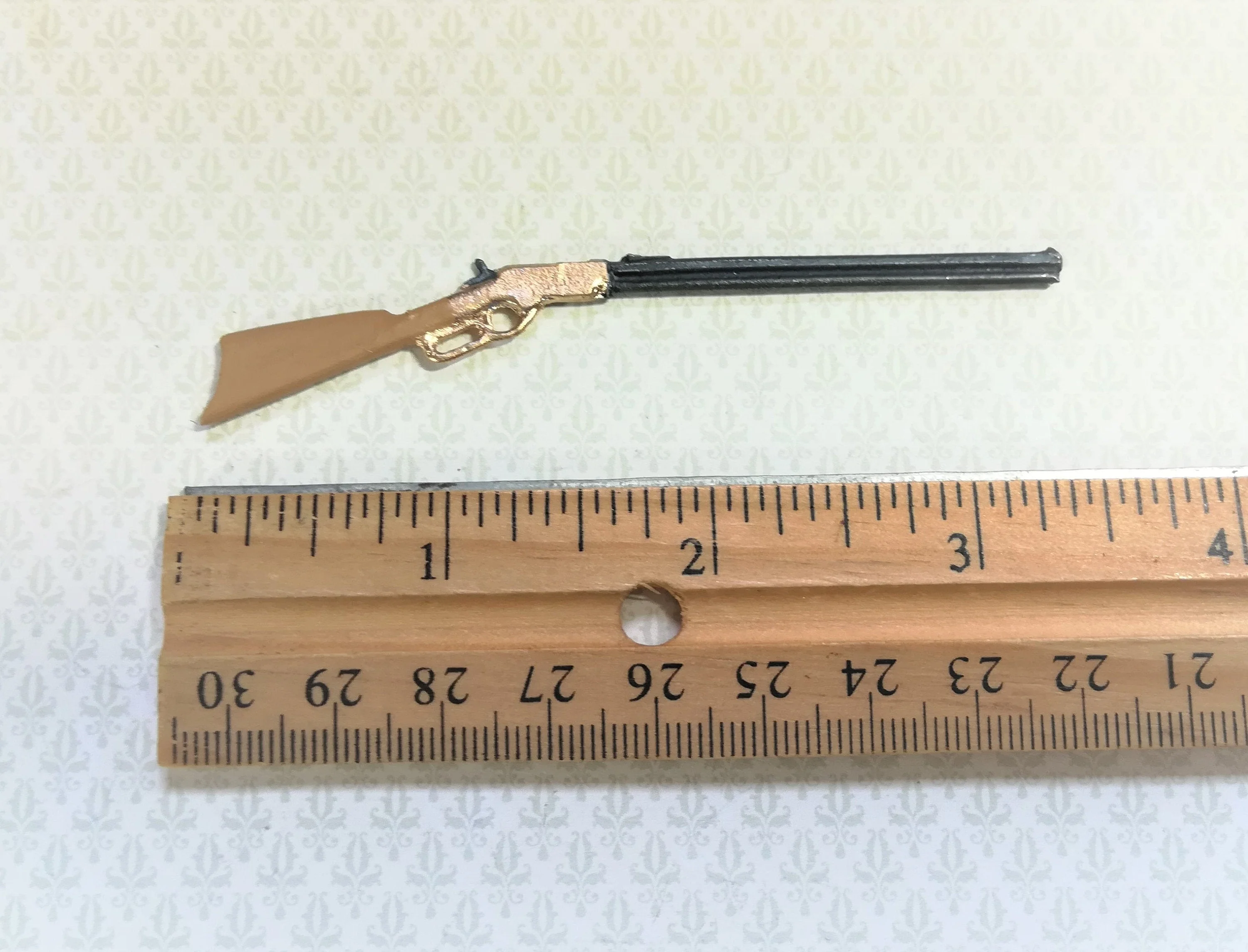 Dollhouse Winchester Rifle measuring 3.5" long (8.8 cm) Painted metal, brown stock with gold action by Island Craft Miniatures - Image 2